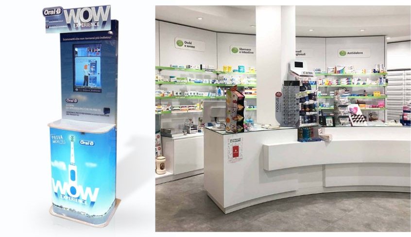 Foto di interno di una farmacia e di un espositore prodotti in vendita